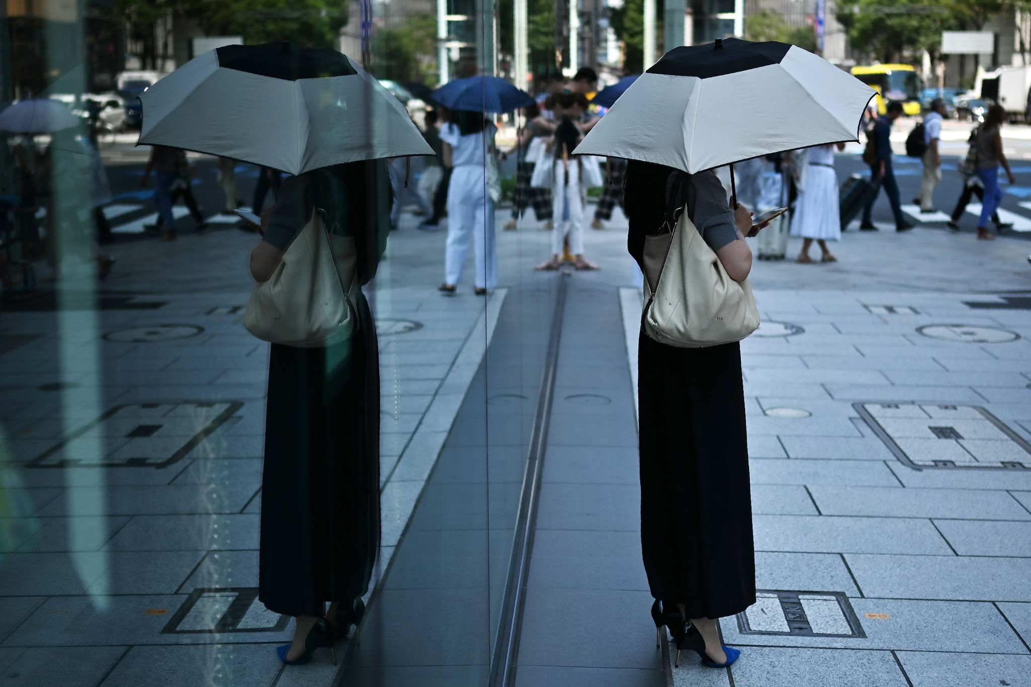 People in Japan have resorted to using umbrellas to shield themselves from soaring temperatures ©Getty Images
