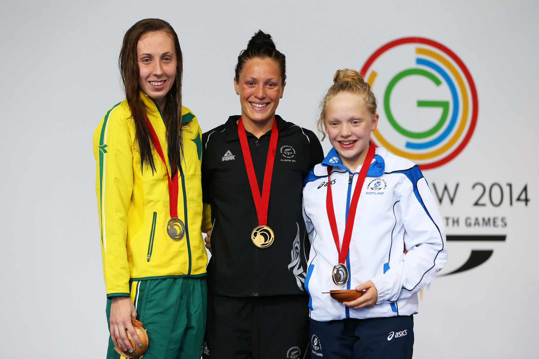Gold medallist Sophie Pascoe of New Zealand poses with silver medallist Madeleine Scott of Australia and bronze medallist Erraid Davies of Scotland during the medal ceremony for the Women's 100m Breaststroke SB9 Final at Tollcross International Swimming Centre ©Getty Images