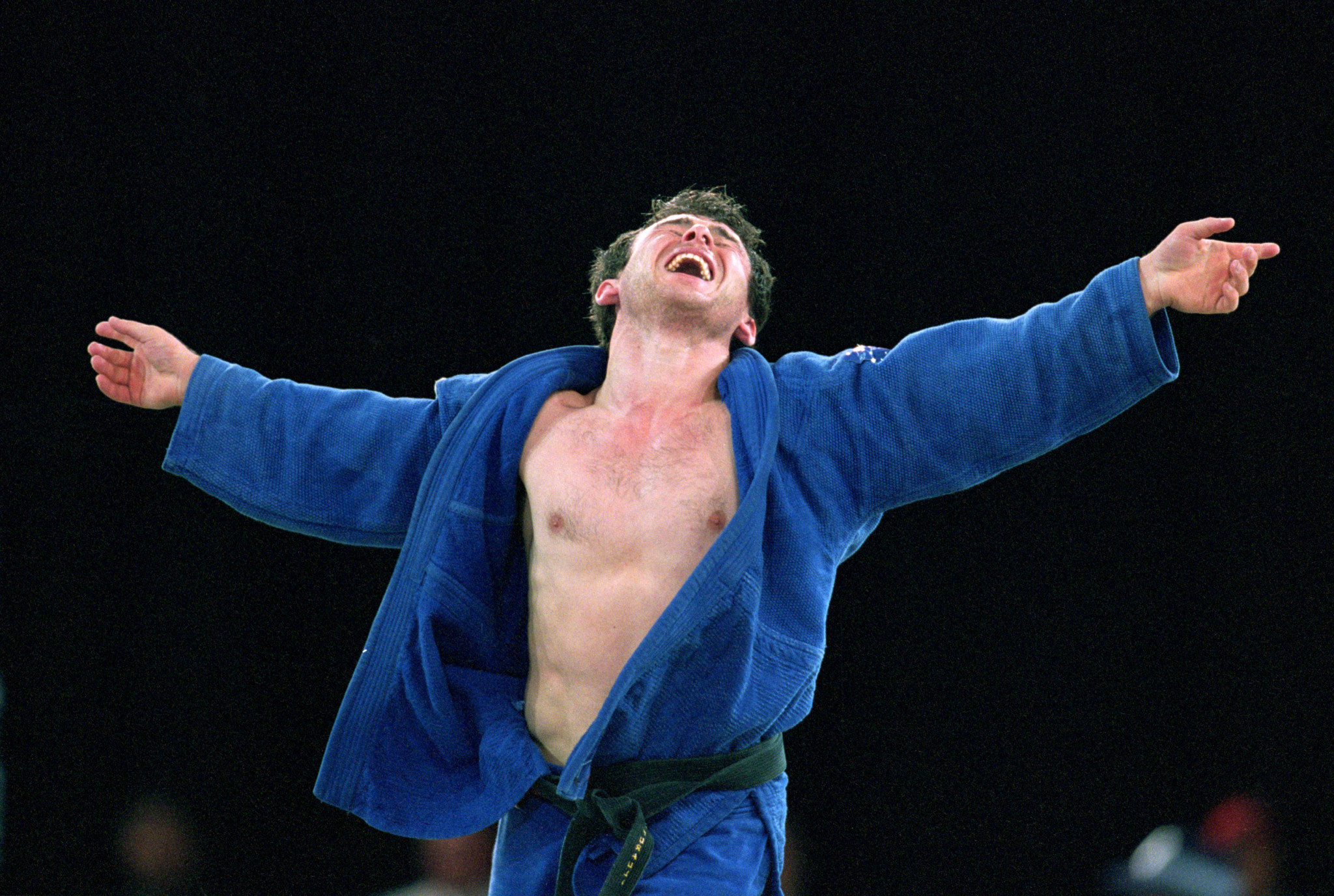 Giorgi Vazagashvili of Georgia celebrates bronze in the Men's 66kg Judo event at the Exhibition Halls in Darling Harbour on Day Two of the Sydney 2000 Olympic Games in Sydney, Australia ©Getty Images