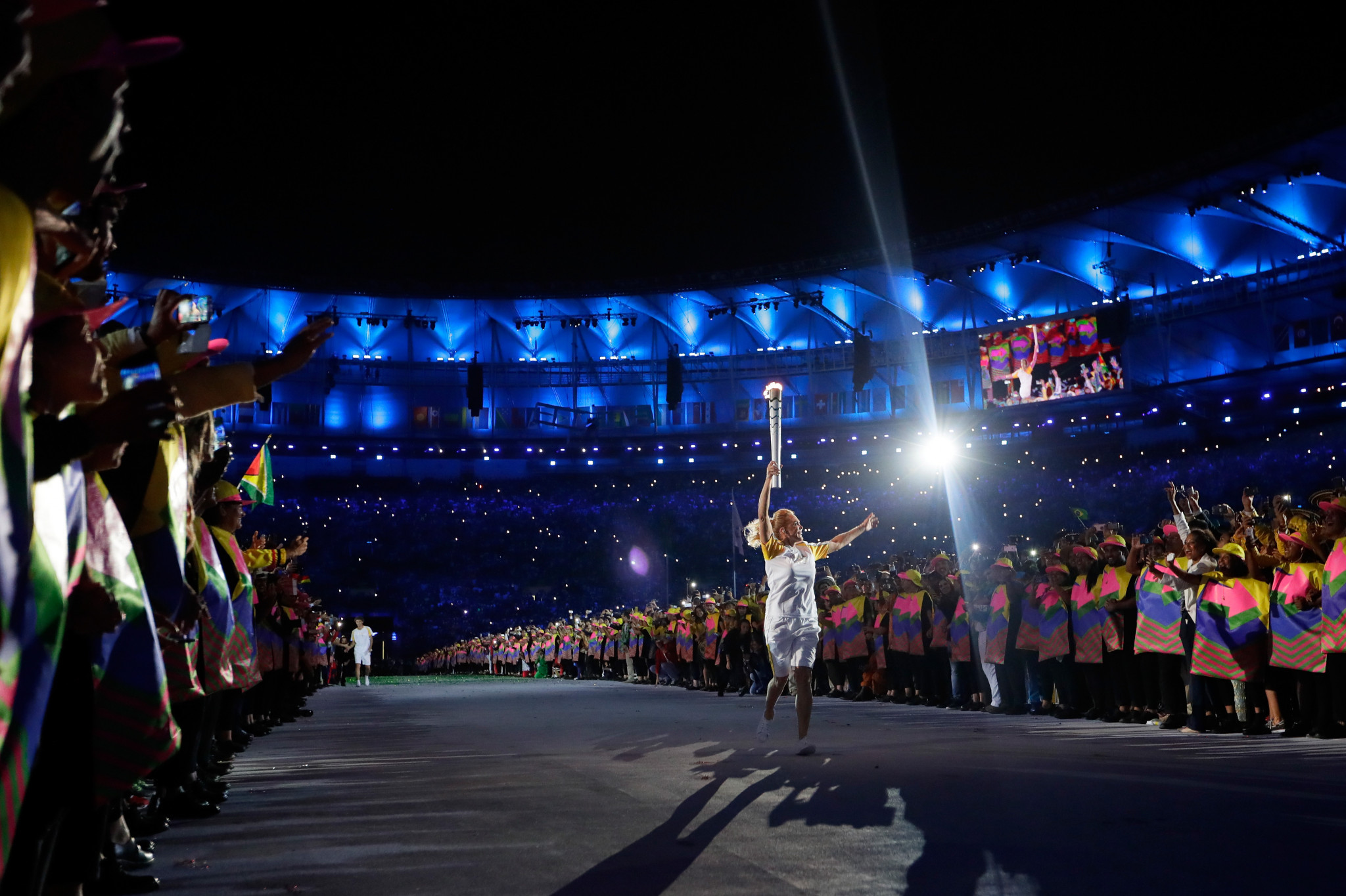 Hortencia Marcari carries the Olympic torch during the Opening Ceremony of the Rio 2016 Olympic Games ©Getty Images