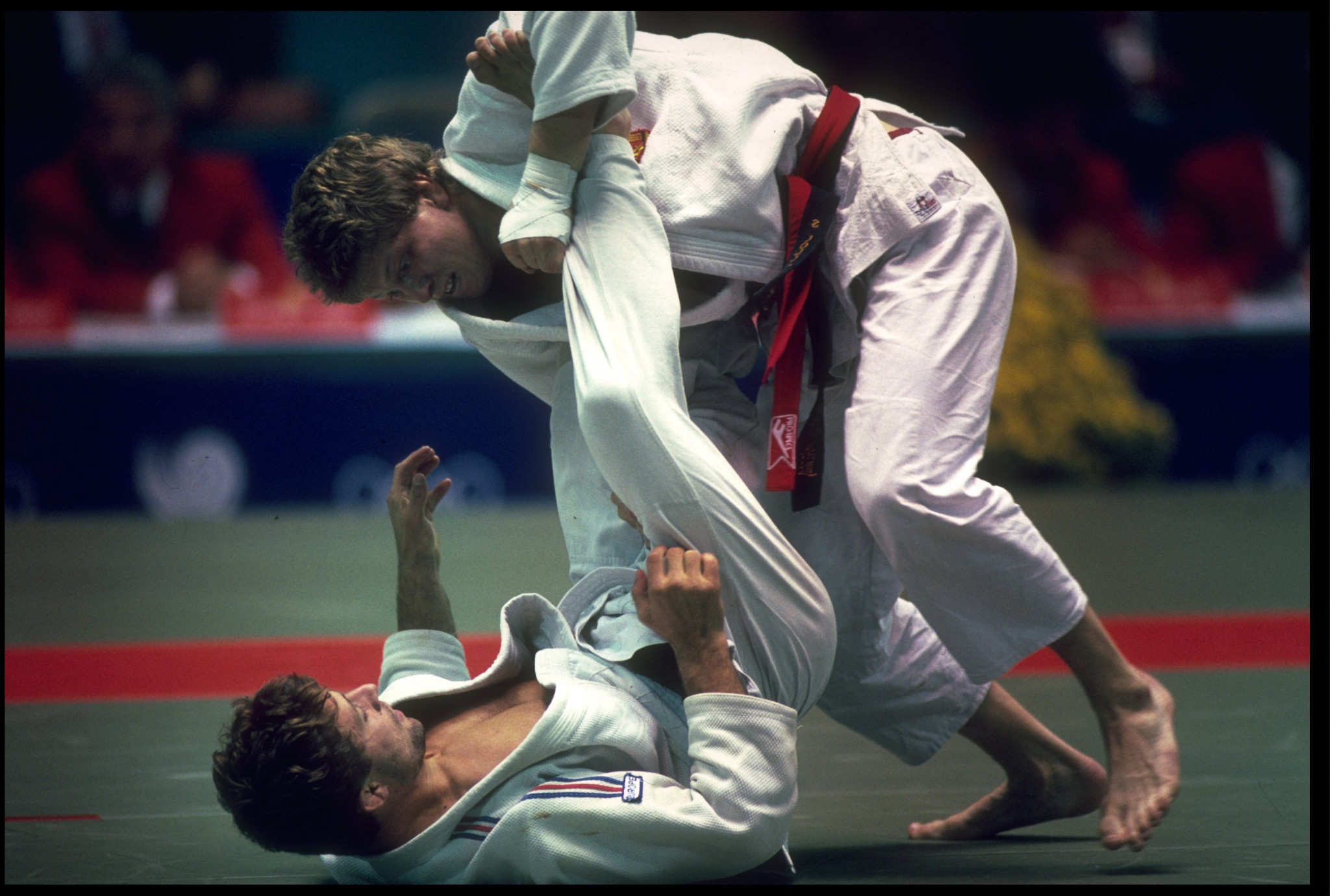 Marc Alexandre of France knocks Sven Loll of East Germany to the mat during the final of the mens lightweight judo competition at the 1988 Seoul Olympics ©Getty Images