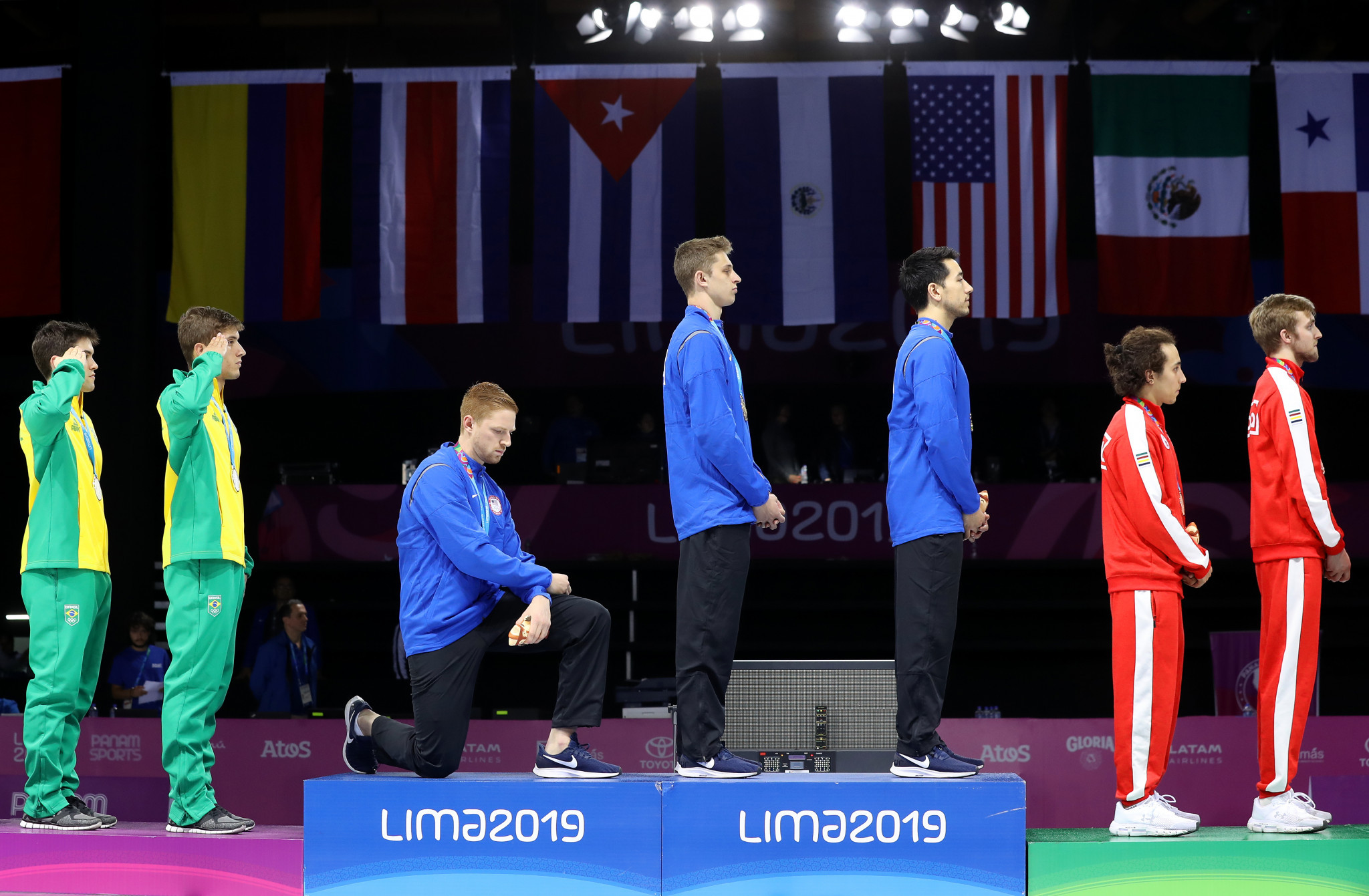Imboden and Berry stage podium protests at Lima 2019 to call for change in United States