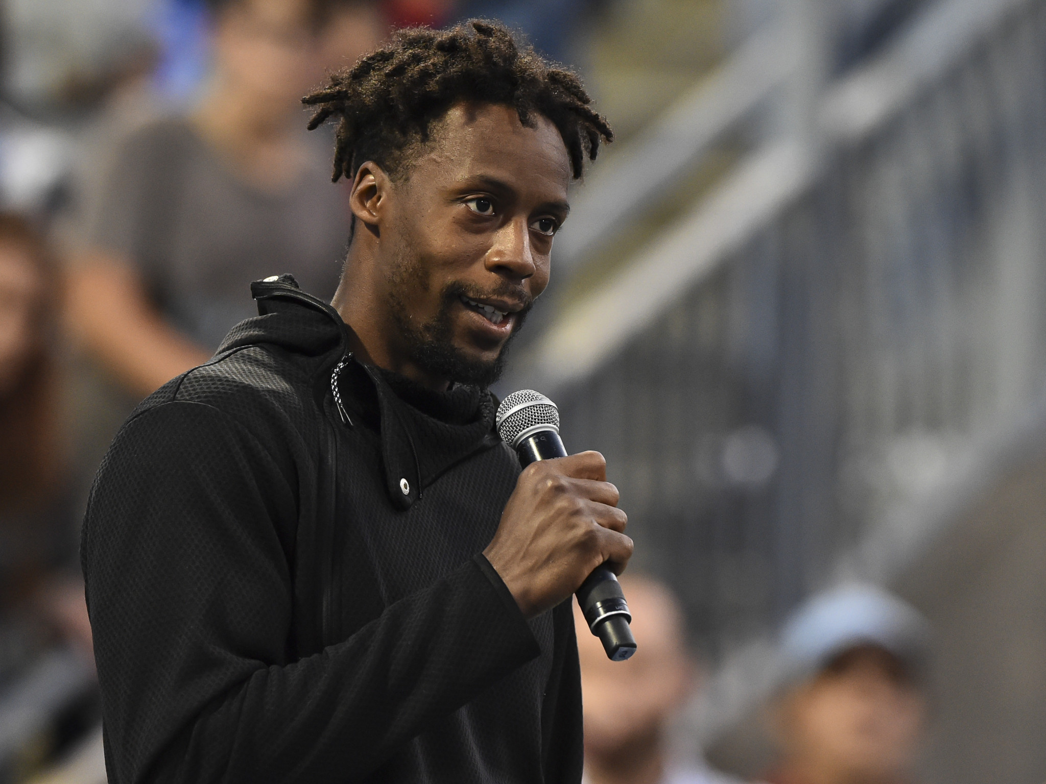 Gaël Monfils of France addresses the spectators after withdrawing from his Rogers Cup match against Rafael Nadal of Spain ©Getty Images