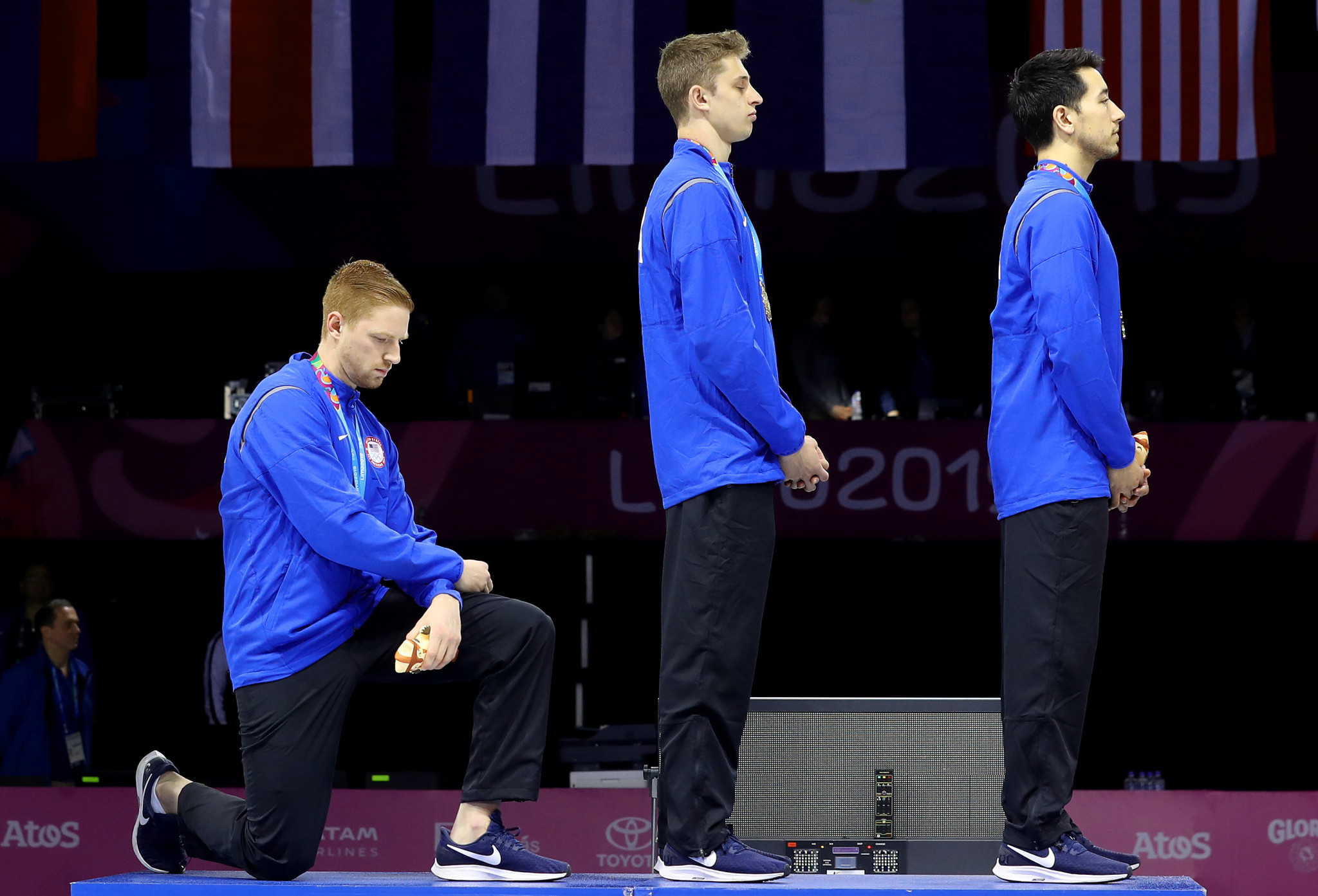 Race Imboden took a knee during the men's team foil medal ceremony ©Getty Images
