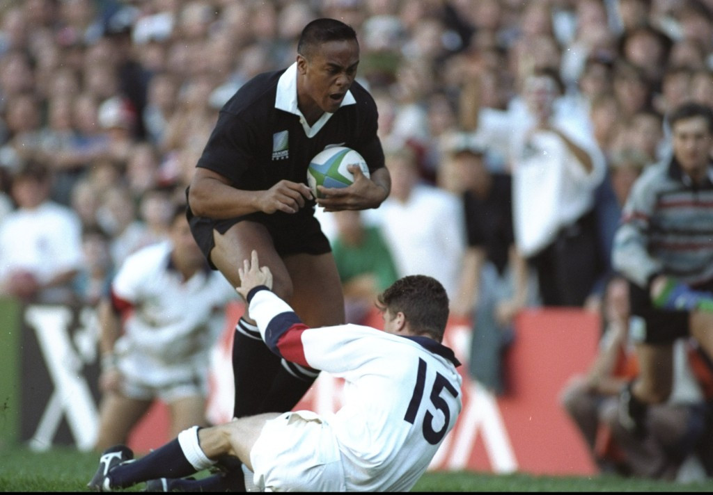 Mike Catt's last line of defence crumbles as Jonah Lomu the unstoppable rumbles over him in the 1995 Rugby World Cup semi-final against England in Cape Town 