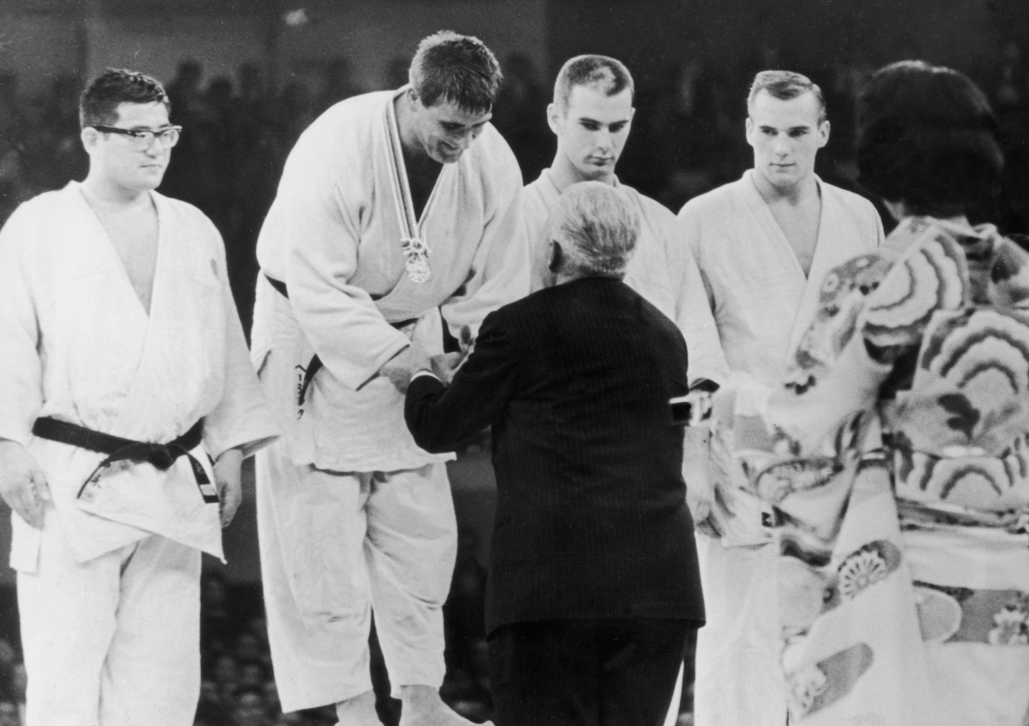Glahn, far right, collecting bronze at the first ever Olympic judo competition at the 1964 Games ©Getty Images