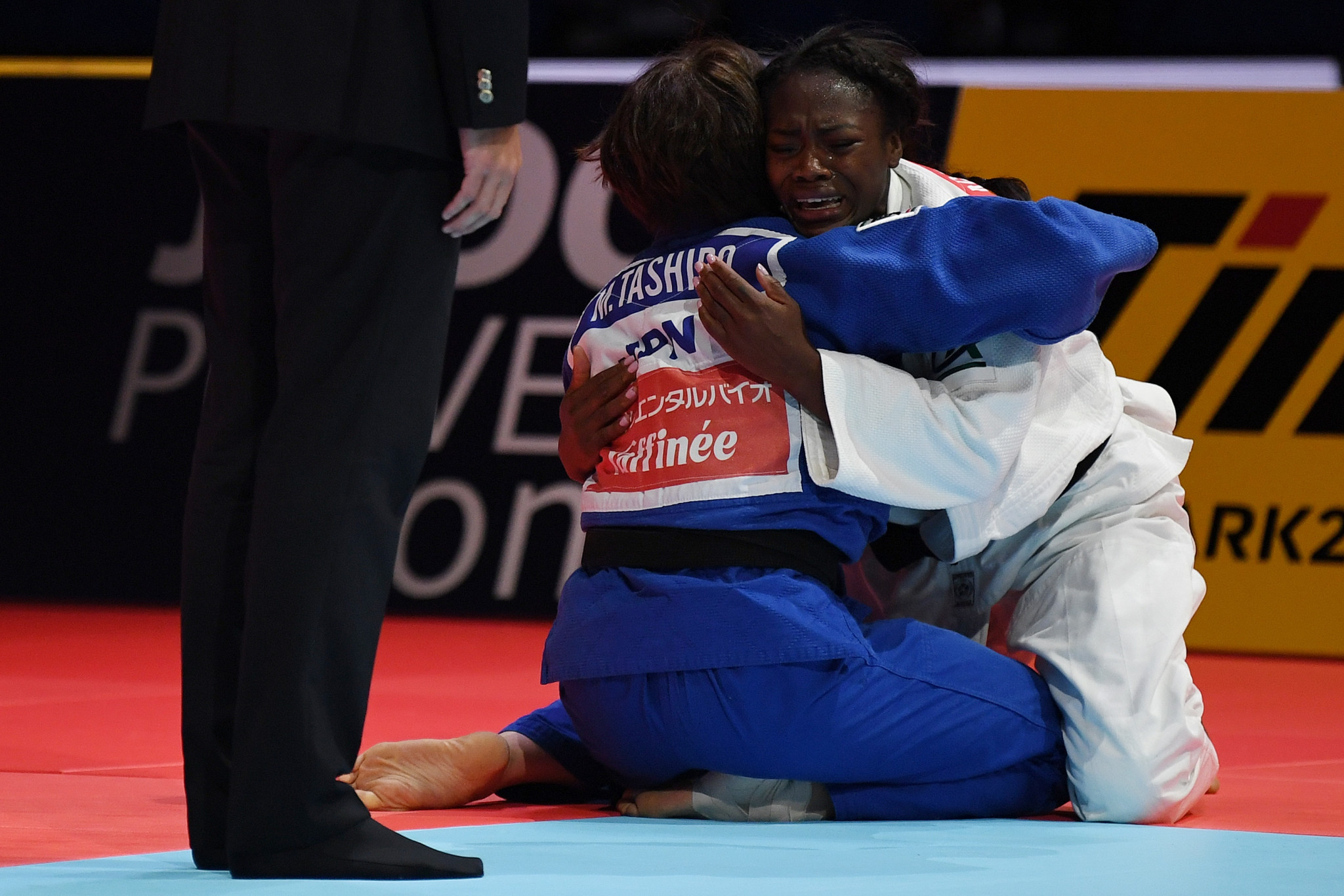 The two friends embrace after Agbegnenou won her fourth World Championship ©Getty Images