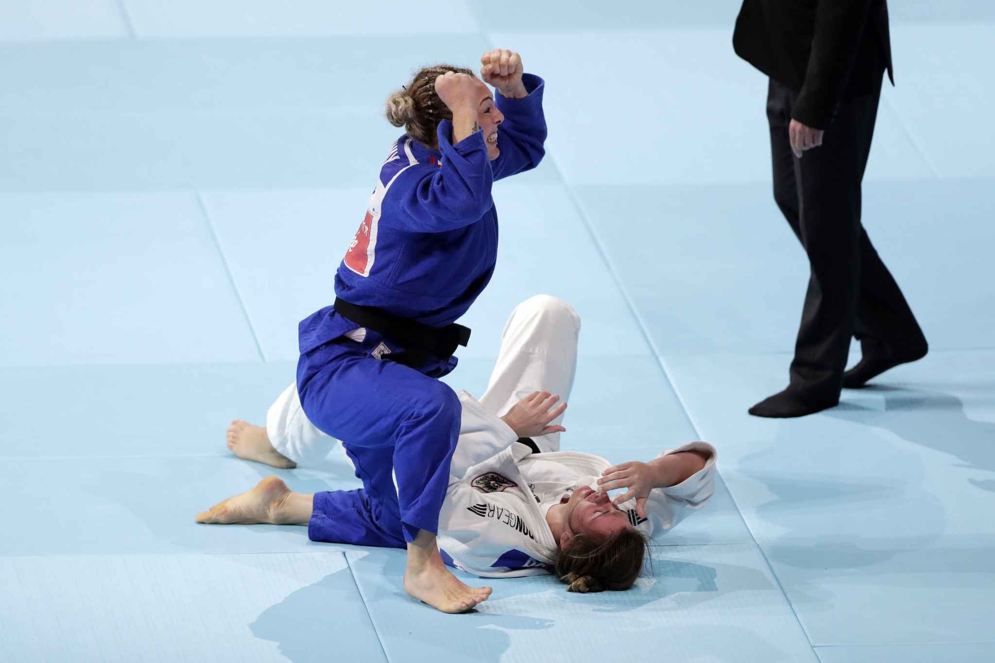 Britain's Sally Conway, blue, was among the bronze medallists at the Nippon Budokan ©Getty Images