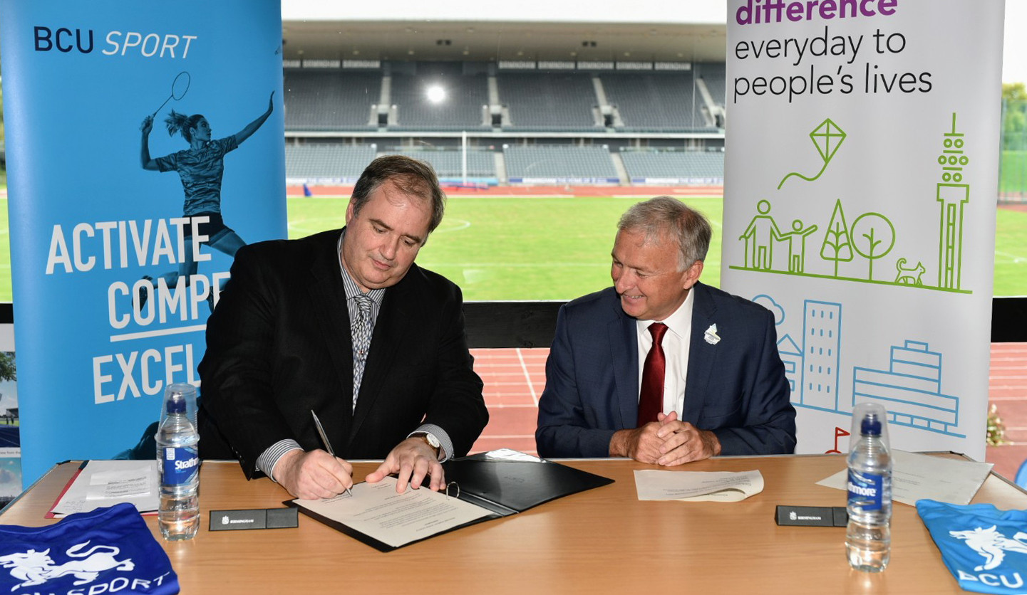 Birmingham City University vice-chancellor Philip Plowden, left, and Birmingham City Council leader Ian Ward, right, signed the deal that will see Alexander Stadium leave a major legacy after the Commonwealth Games ©Nick Robinson - Birmingham City University