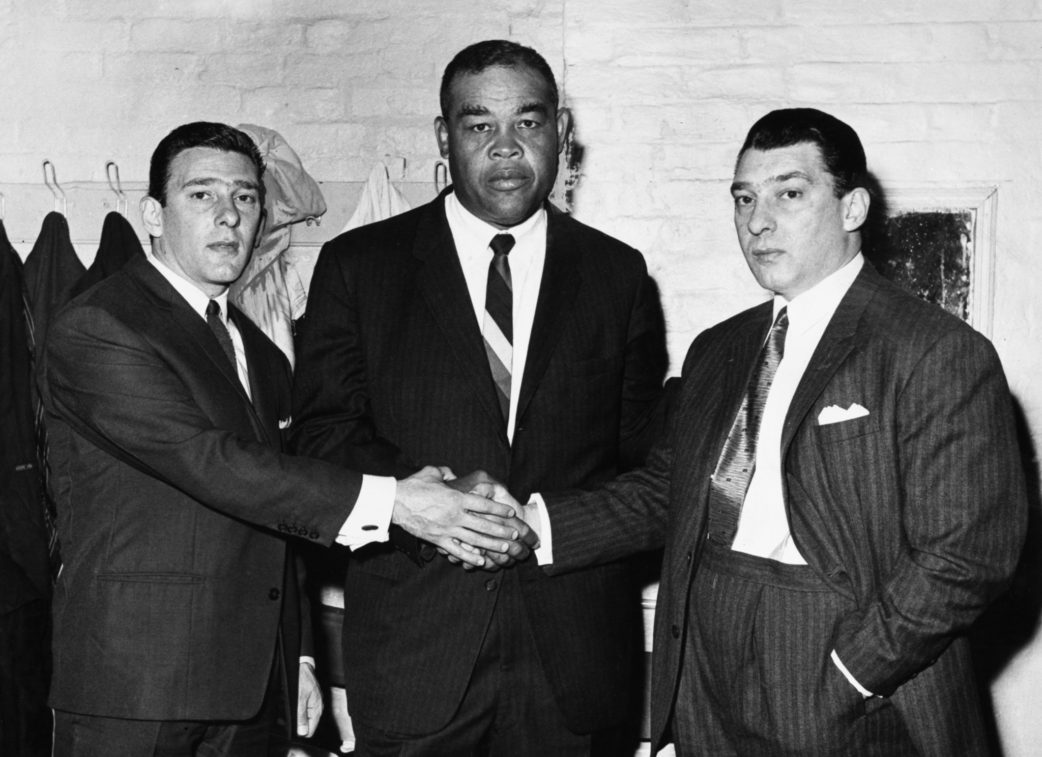 The feared Kray twins (Ronnie, left, Reggie, right) loved boxing, pictured here with American heavyweight Joe Louis ©Getty Images