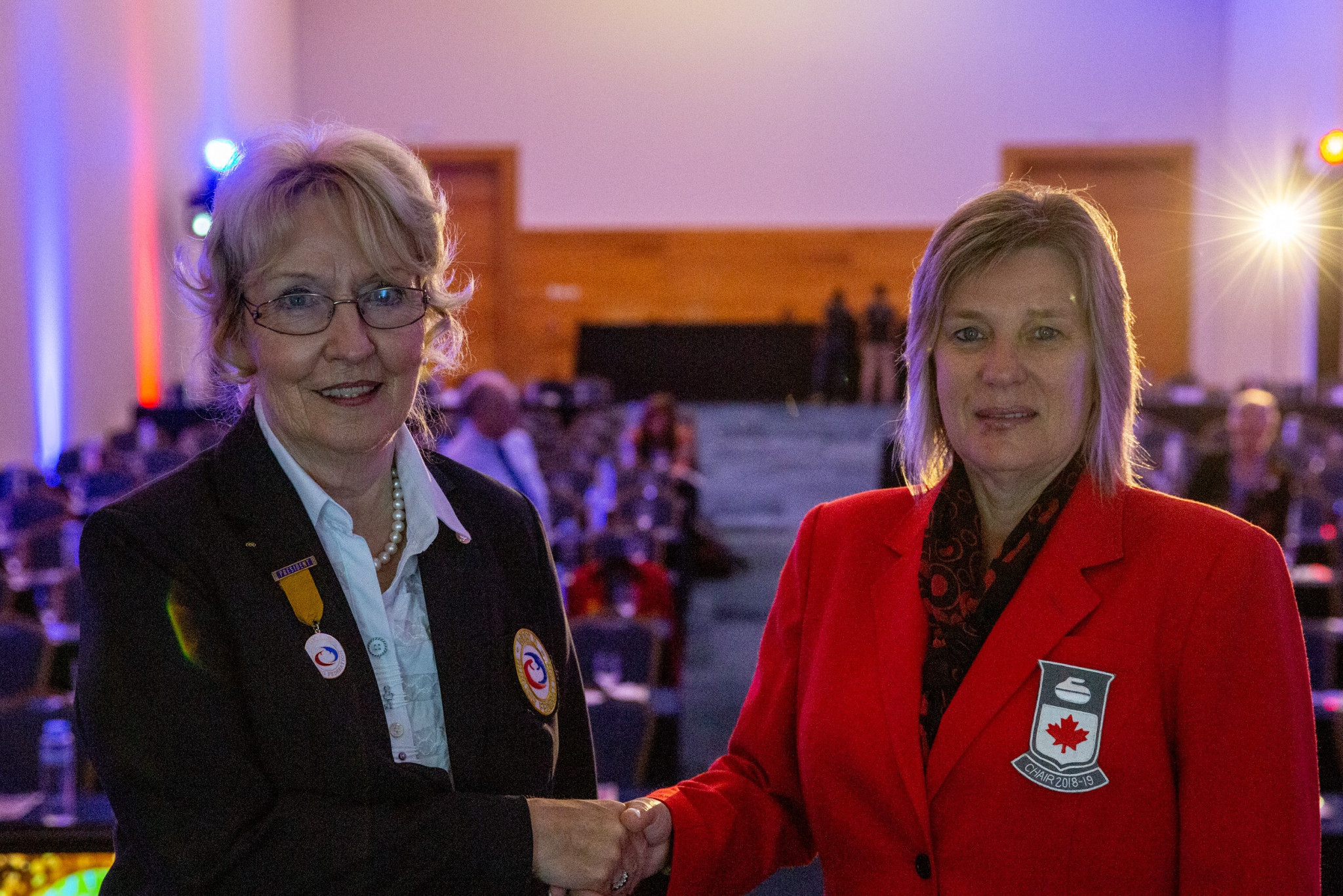 WCF President Kate Caithness and Curling Canada chief executive Katherine Henderson signed the agreement in Cancun ©WCF