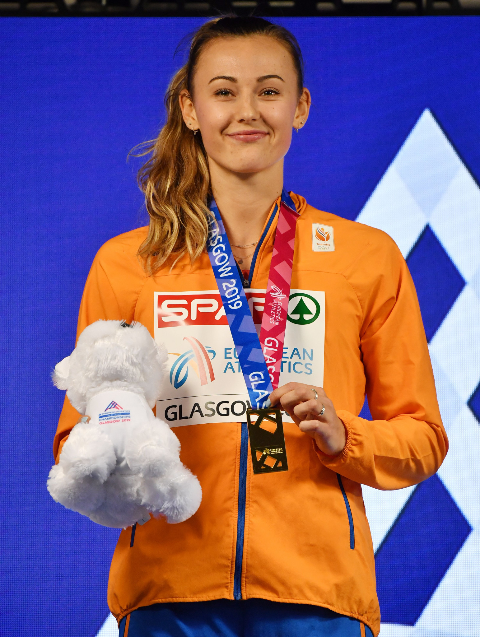 Netherlands' Nadine Visser poses on the podium after winning gold in the women's 60m hurdles at the 2019 European Indoor Athletics Championships in Glasgow ©GSA 