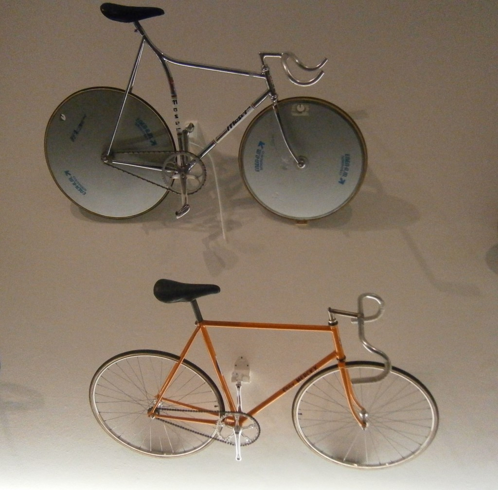 Moser's more aerodynamic bike (top) aided his attempt to break Merckx hour record