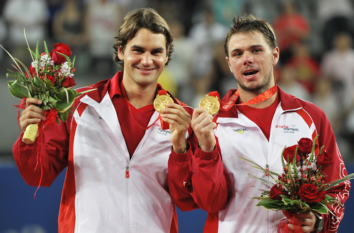 Roger Federer, left, and fellow Swiss Stan Wawrinka celebrate doubles gold at Beijing 2018 ©Getty Images