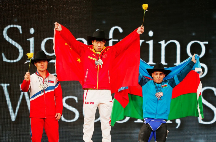 Chen stands atop the men's 62kg overall podium ©Getty Images