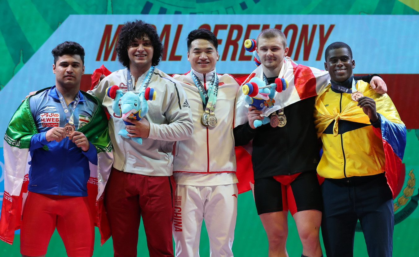 China's Tian Tao, centre, secured his first title on the global stage in the men's 96 kilograms at the International Weightlifting Federation World Championships in Thai city Pattaya ©IWF