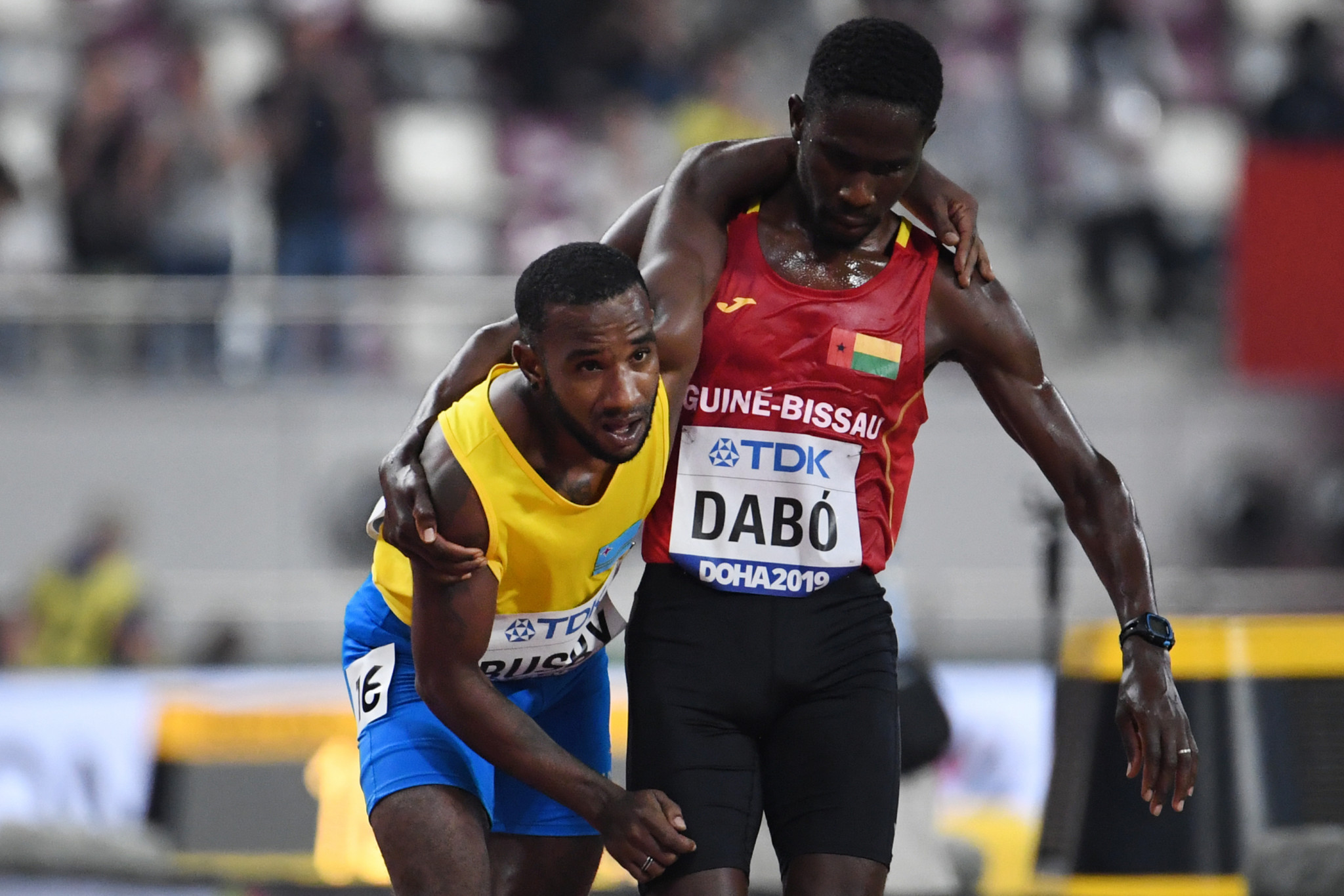 Guinea-Bissau’s Braima Suncar Dabo helped stricken rival, Jonathan Busby of Aruba, cross the finishing line in the 5,000 metres on the opening day of the IAAF World Championships in Doha ©Getty Images 
