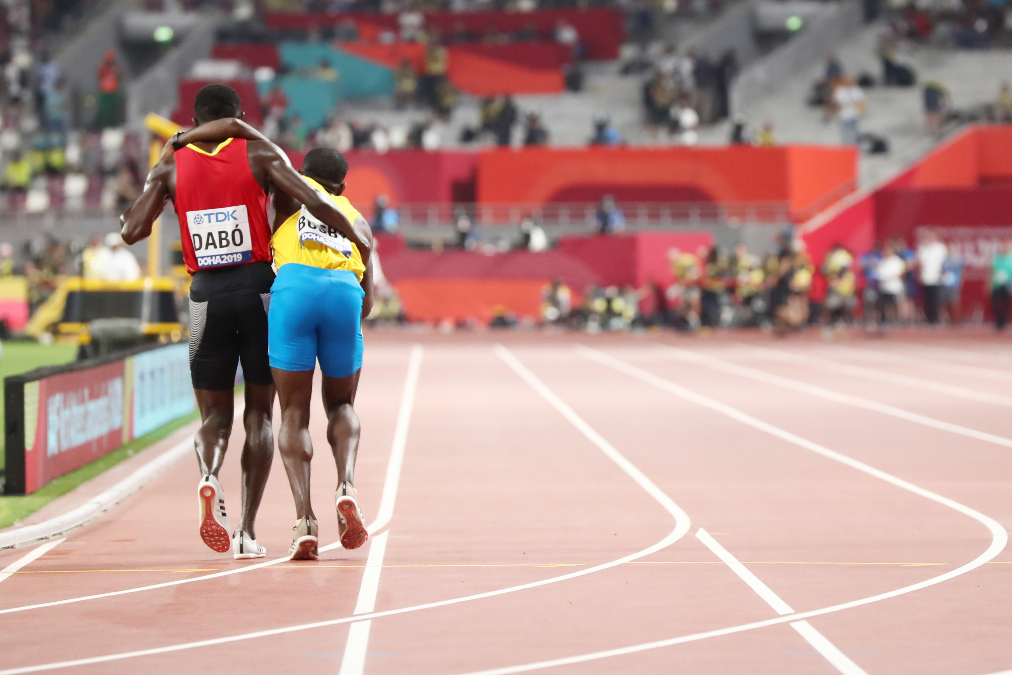 Guinea-Bissau’s Braima Suncar Dabo stopped near the end of his 5,000m heat to help Aruba's Jonathan Busby, who had collapsed with exhaustion ©Getty Images
