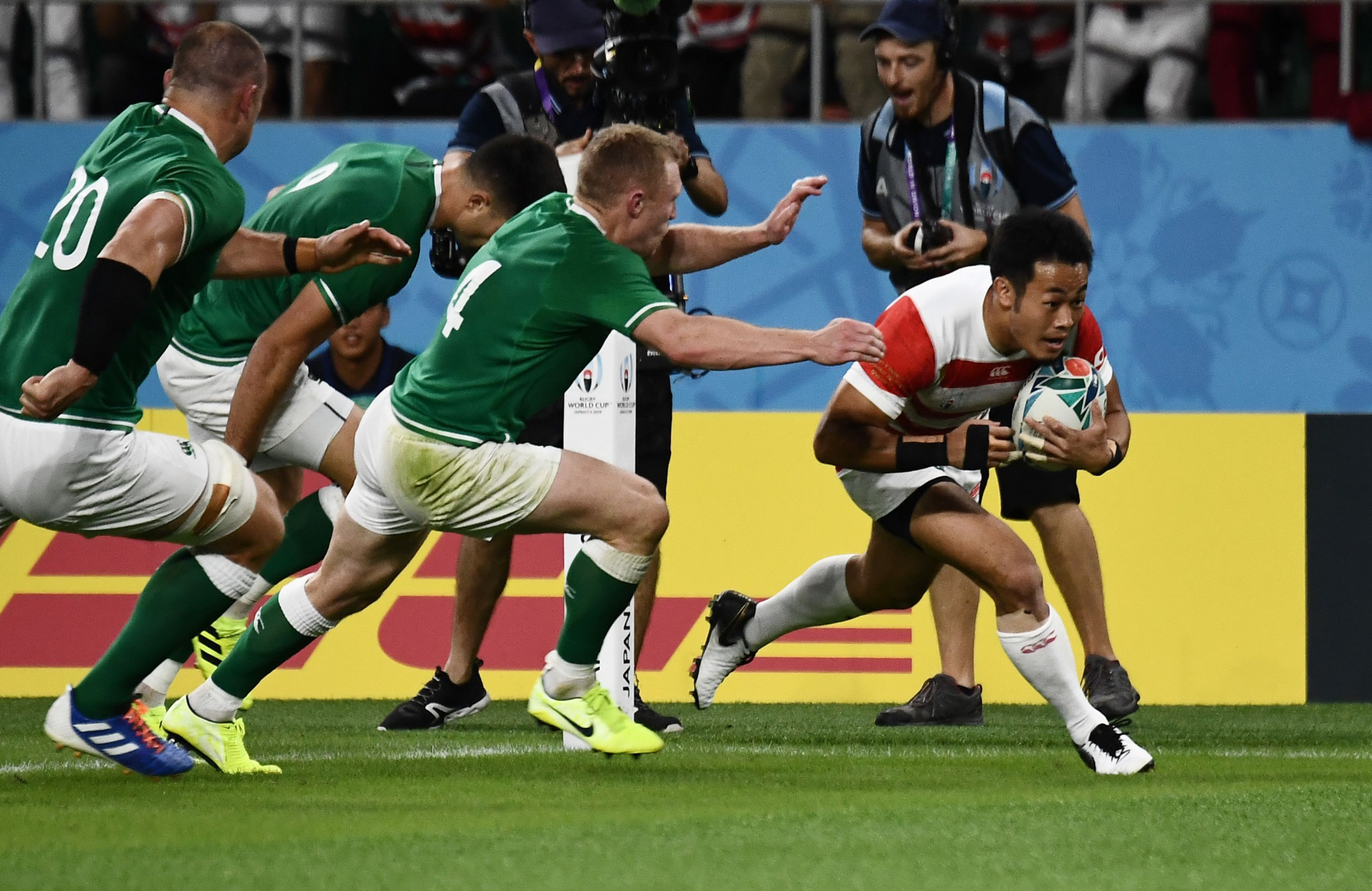 Kenki Fukuoka leaves a trail of Irishmen in his wake, as he scores Japan's crucial try in their shock Rugby World Cup win ©Getty Images