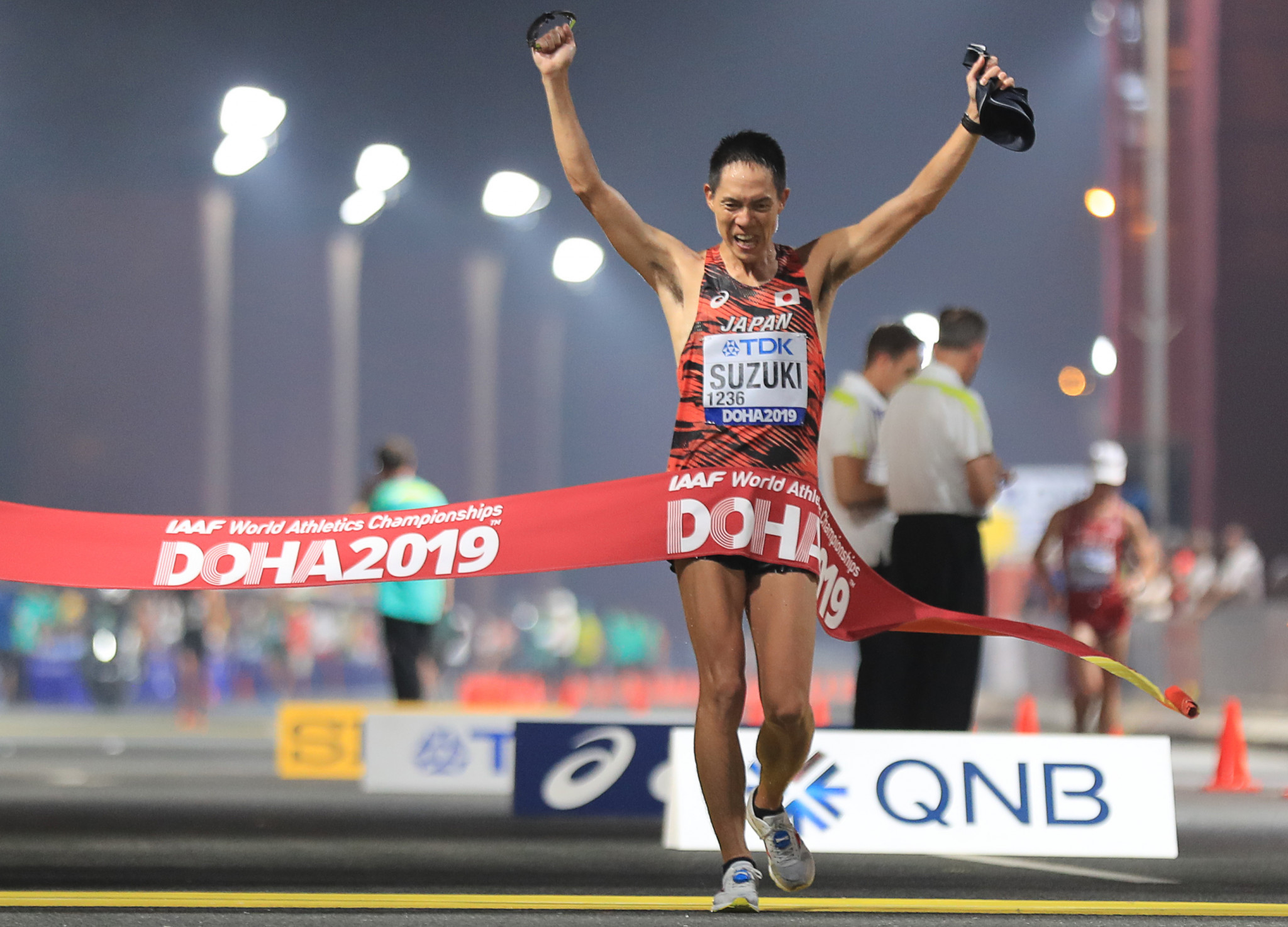 Japan's Yusuke Suzuki celebrates winning the men's 50km race walk in an event that finished after 4am on Sunday morning ©Getty Images