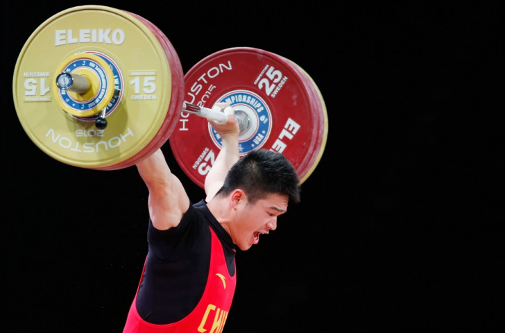China's Zhiyong Shi claimed the men's 69kg clean and jerk and overall titles ©Getty Images 