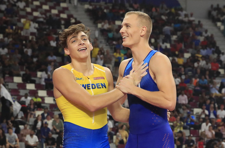 Sam Kendricks of the United States, right, retained his world pole vault title after a monumental competition against Sweden's 19-year-old Armand Duplantis in Doha ©Getty Images