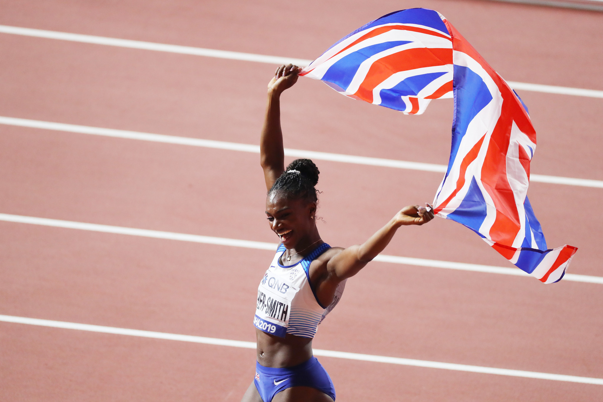 Dina Asher-Smith of Great Britain celebrates after winning gold in the women's 200 metres final at the IAAF World Championships in Doha ©Getty Images
