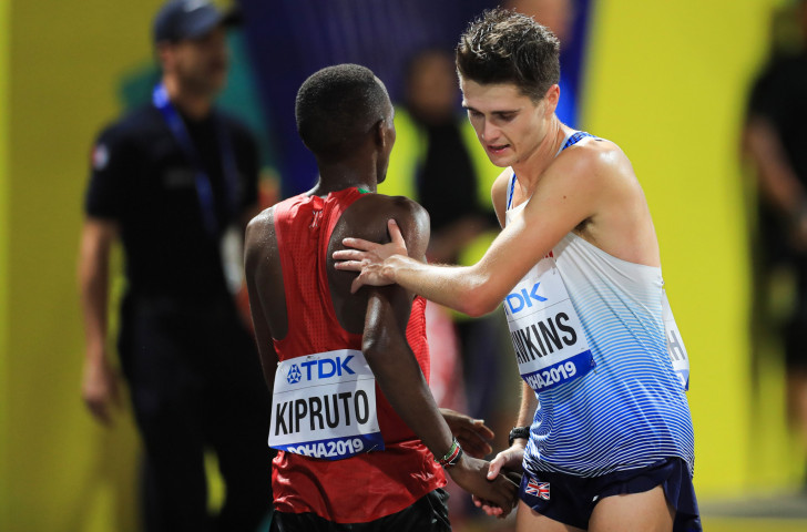 Britain's Callum Hawkins congratulates third-placed Amos Kipruto of Kenya after finishing fourth for the second successive time in the IAAF World Championships men's marathon ©Getty Images