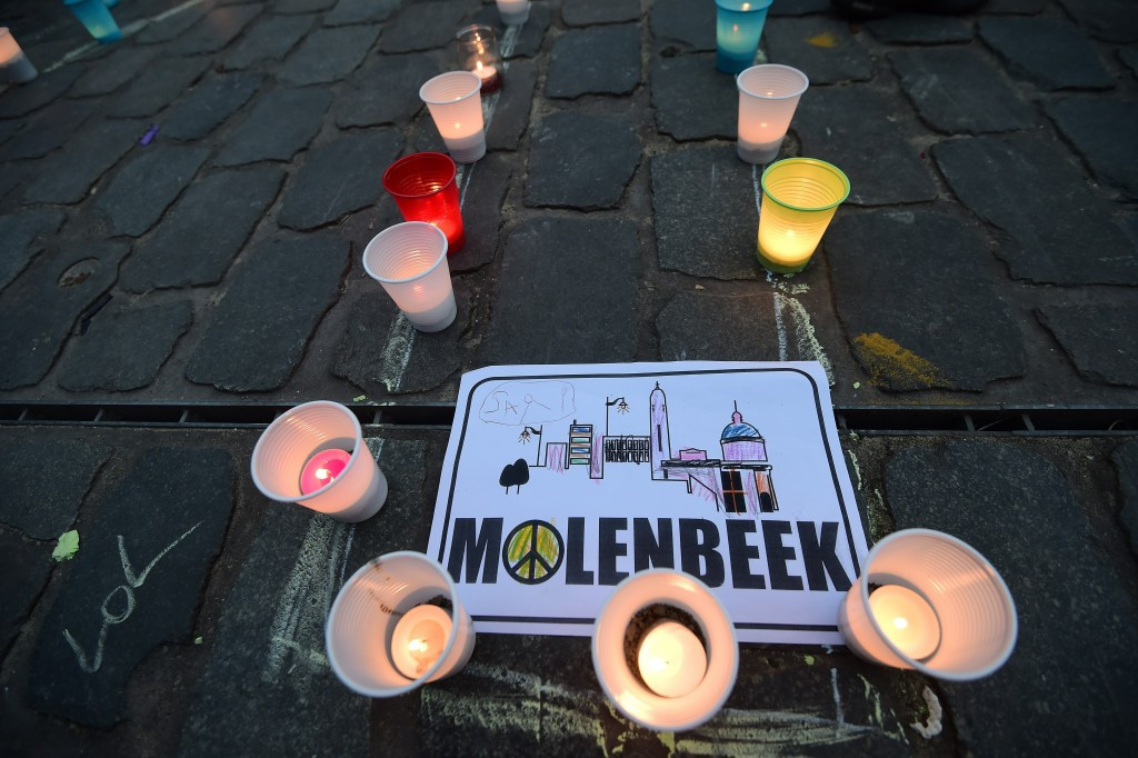 A candle light vigil to the victims of the Paris attacks in Brussels' Molenbeek district. The area's football club is finding new life