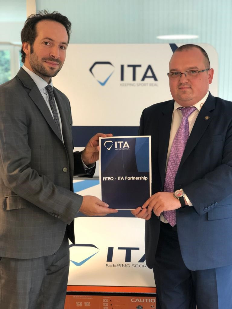 FITEQ head of international relations Marius Vizer junior, right, and ITA director general Benjamin Cohen, left, signed the agreement between the two parties ©FITEQ