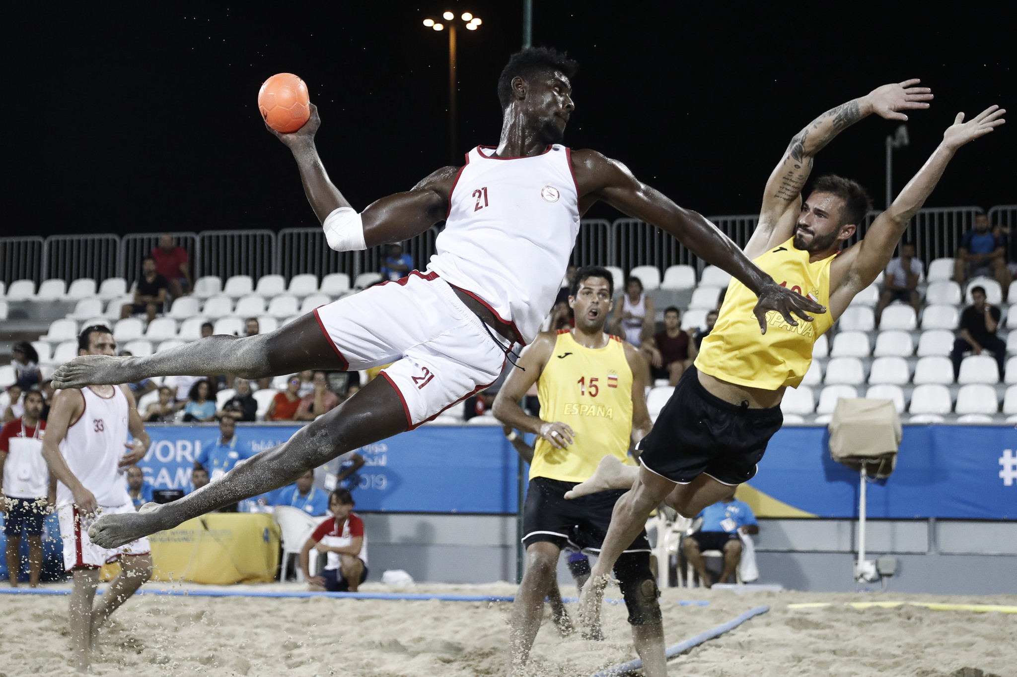 Beach handball players take to the air ©ANOC