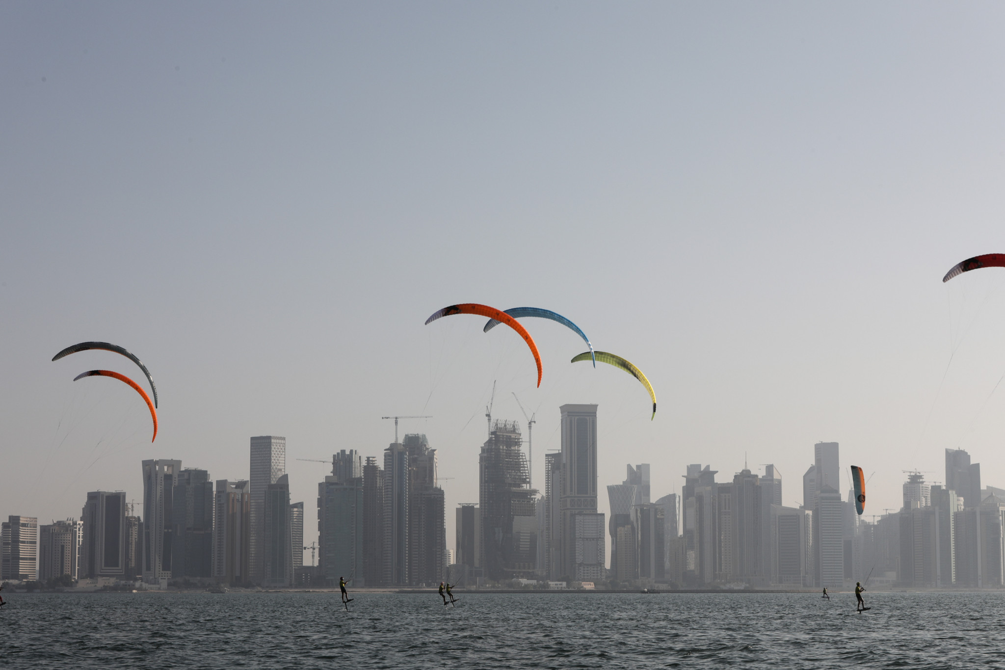 The women's kitefoil racing title was decided in front of Doha's skyline ©ANOC