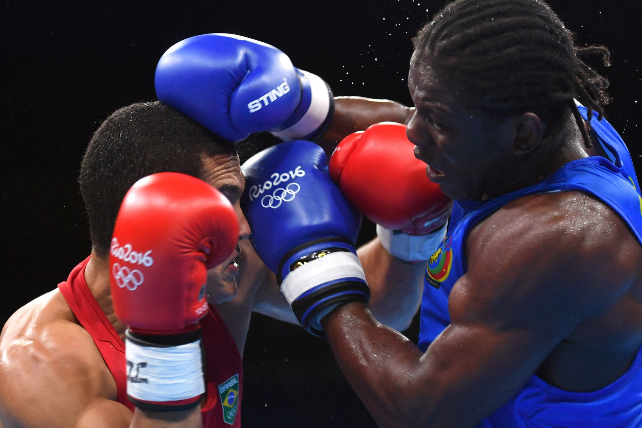 Cameroon's Hassan N'Dam, in blue, was one of three professional boxers to compete at Rio 2016 but he was beaten in the opening bout by Brazil's Michel Borges in the 81-kilograms category ©Getty Images