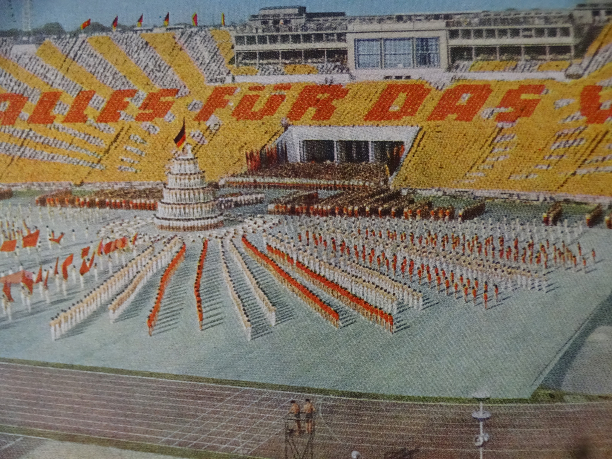 A GDR stadium show with flashcards