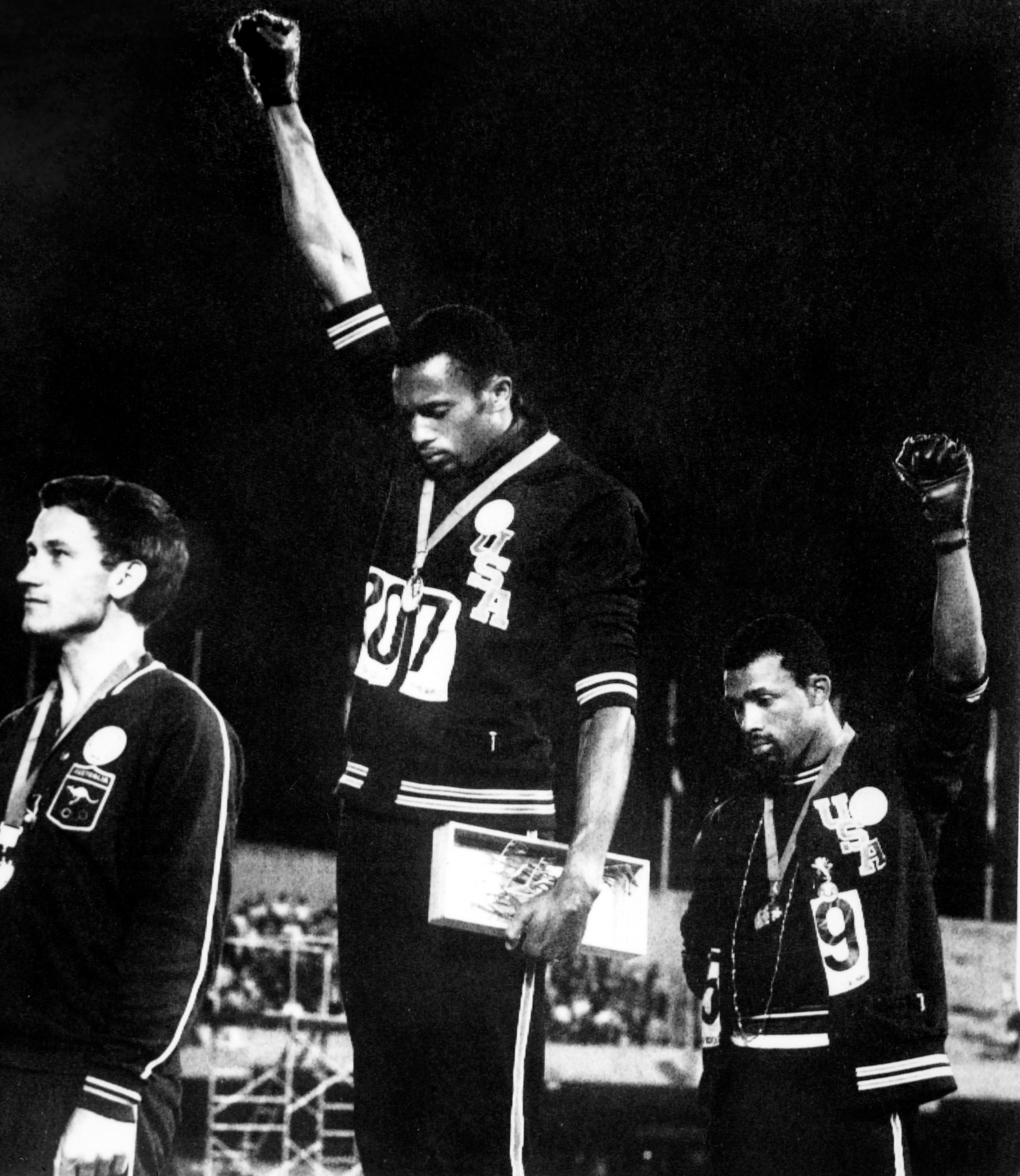 Australia's Peter Norman, left, stands with US sprinters Tommie Smith, centre, and John Carlos during their civil rights protest following the 200m final at the 1968 Mexico City Olympics ©Getty Images