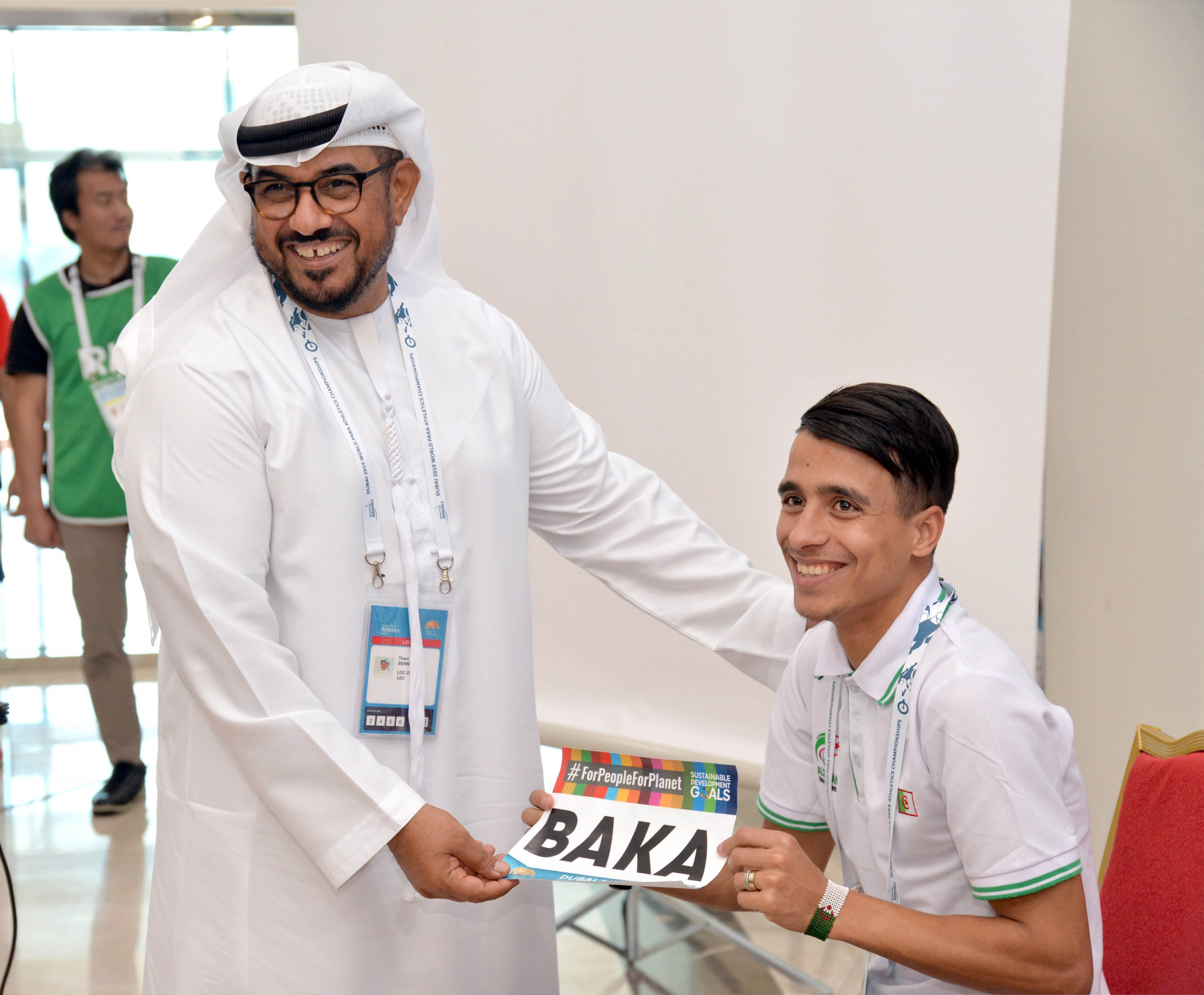 Algerian runner Abdellatif Baka received his bib from Dubai 2019 Organising Committee chairman, Thani Juma Berregad ©Dubai 2019