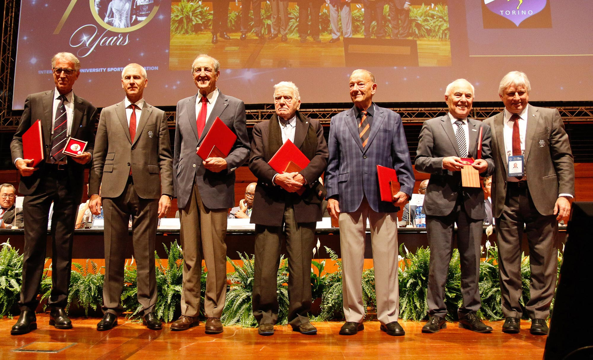 The inaugural winners of the Primo Nebiolo medals accept the congratulations of the General Assembly ©FISU