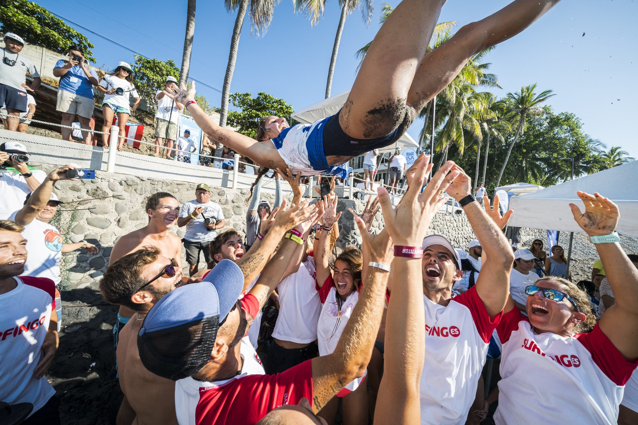 Itziar Abascal of Spain is thrown into the air after her paddleboard prone technical race victory ©ISA