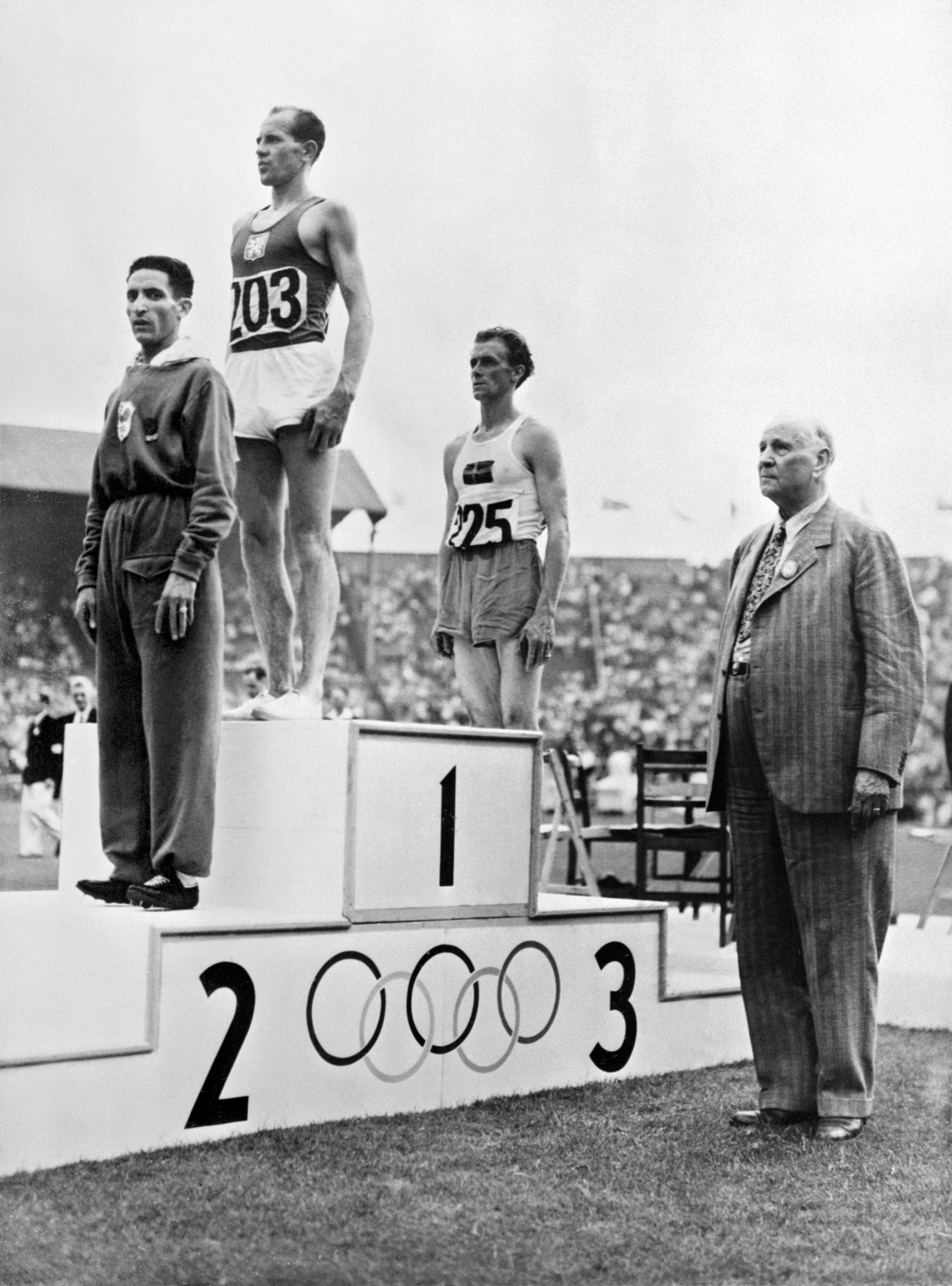 The way it was for two Olympics - Czechoslovakia's Emil Zatopek tops the podium after the 10,000m final at London 1948, with French rival Alain Mimoun in silver medal position ©Getty Images