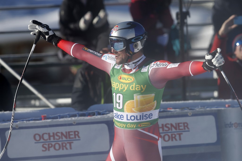 Aksel Lund Svindal celebrates after adding the Super-G title to his downhill win in Lake Louise