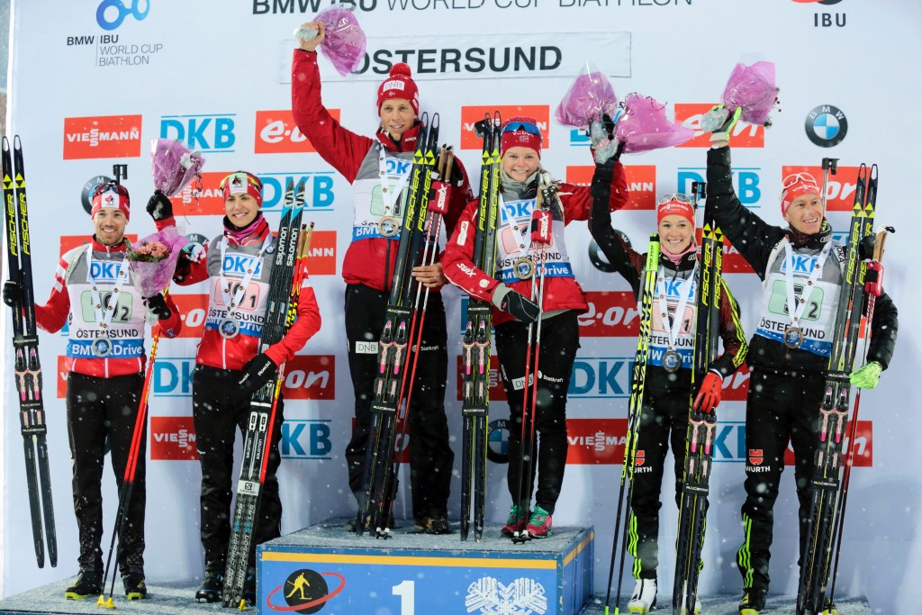 Lars Helge Birkeland and Kaia Nicolaisen stand on top of the podium after an opening IBU World Cup win in Sweden ©Getty Images 