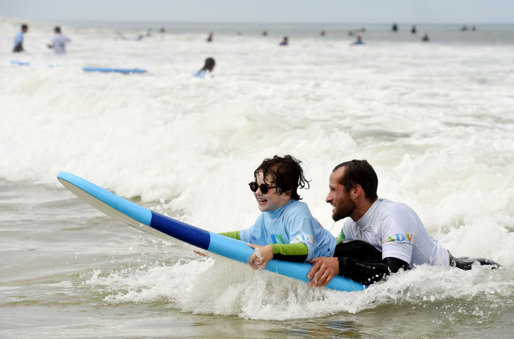 A young blind boy benefits from a See Surf event at the Lacanau beach in south-west France held last year ©Getty Images