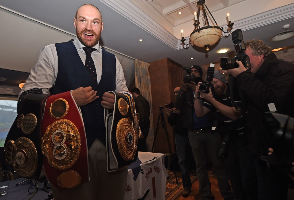 Tyson Fury posing with his belts following his shock victory ©Getty Images