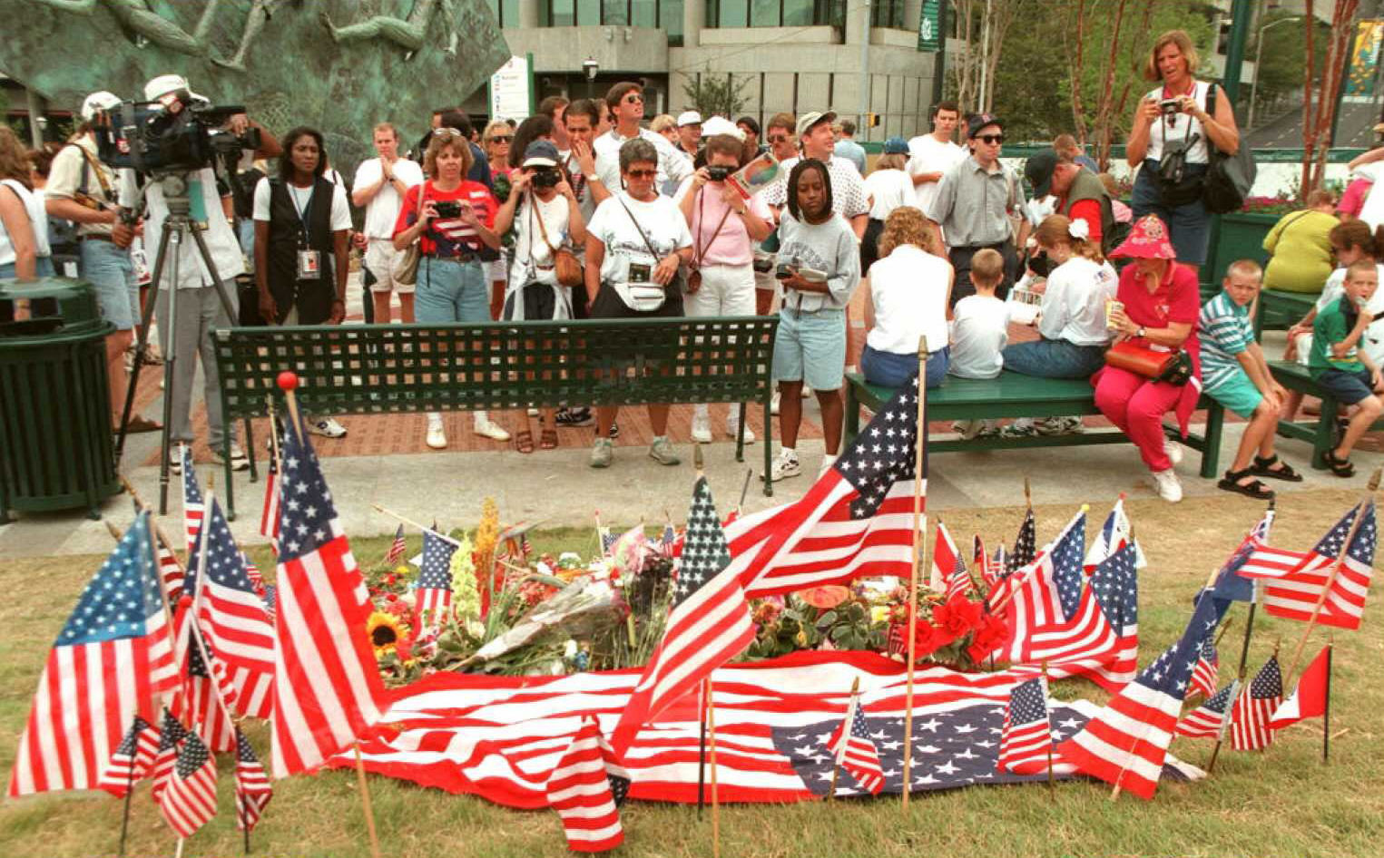 Flags and flowers are laid at the site of the bombing at the Centennial Olympic Park in Atlanta in July 1996 ©Getty Images