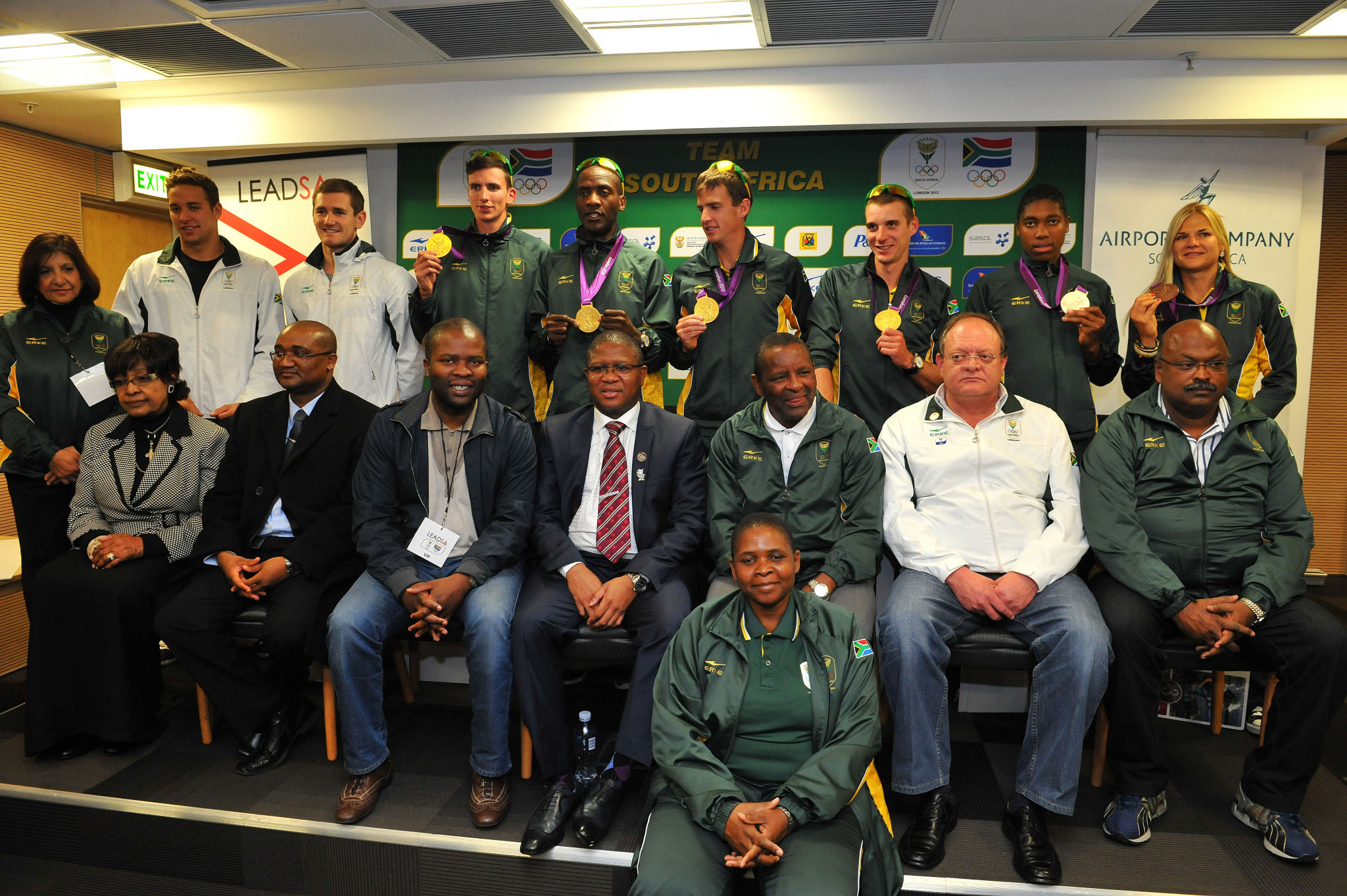 Gideon Sam, third right in front row, poses with some of South Africa's medal winners from London 2012 after they arrived home in Johannesburg ©Getty Images