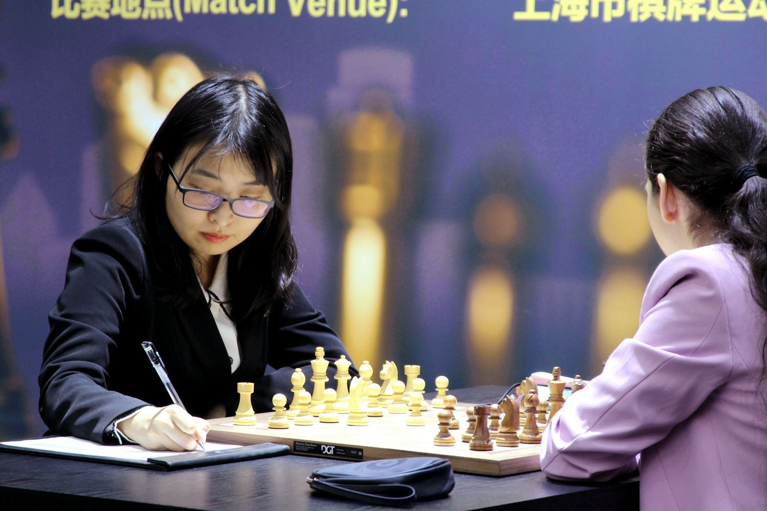 Defending champion Ju Wenjun played with the white pieces on day two ©FIDE