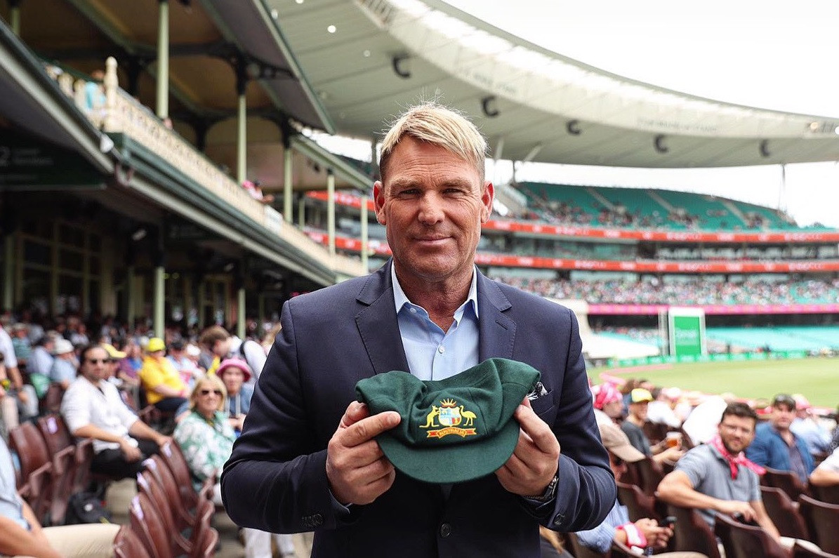Huge bids as Warne auctions baggy green cap for Australian bushfire appeal