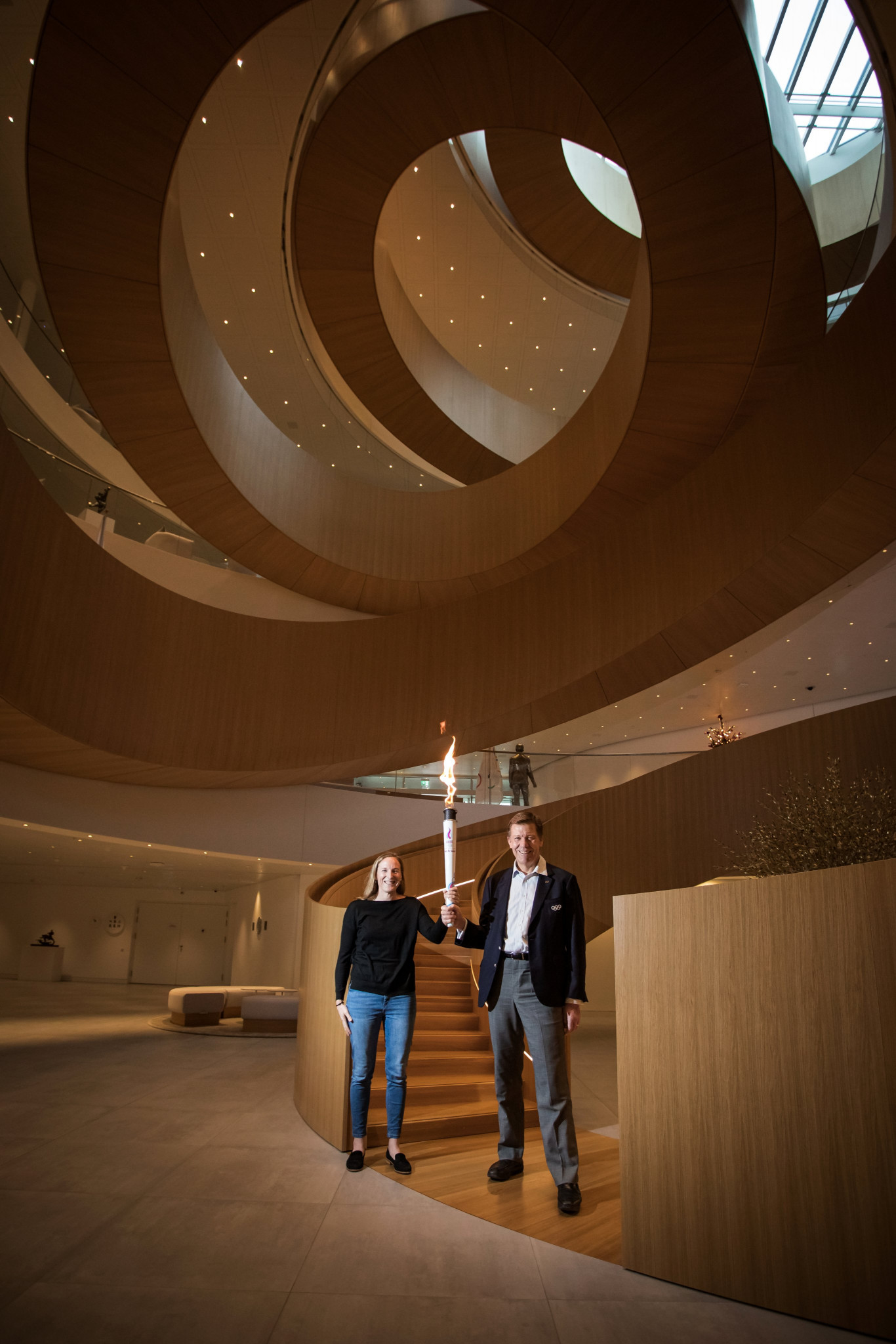 Two International Olympic Committee representatives welcomed the Torch to Olympic House ©Lausanne 2020
