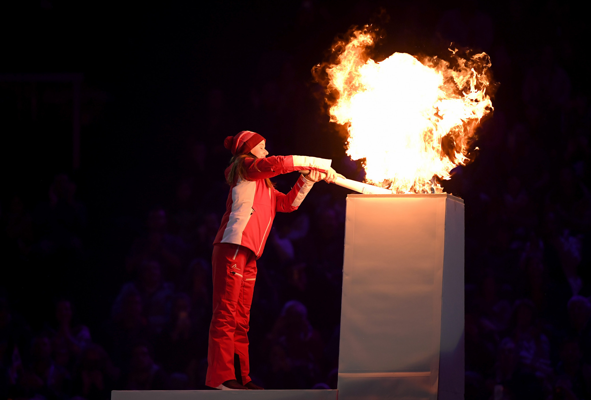 Ice dancer Gina Zehnder, the youngest member of the Swiss team, lit the Cauldron ©Getty Images