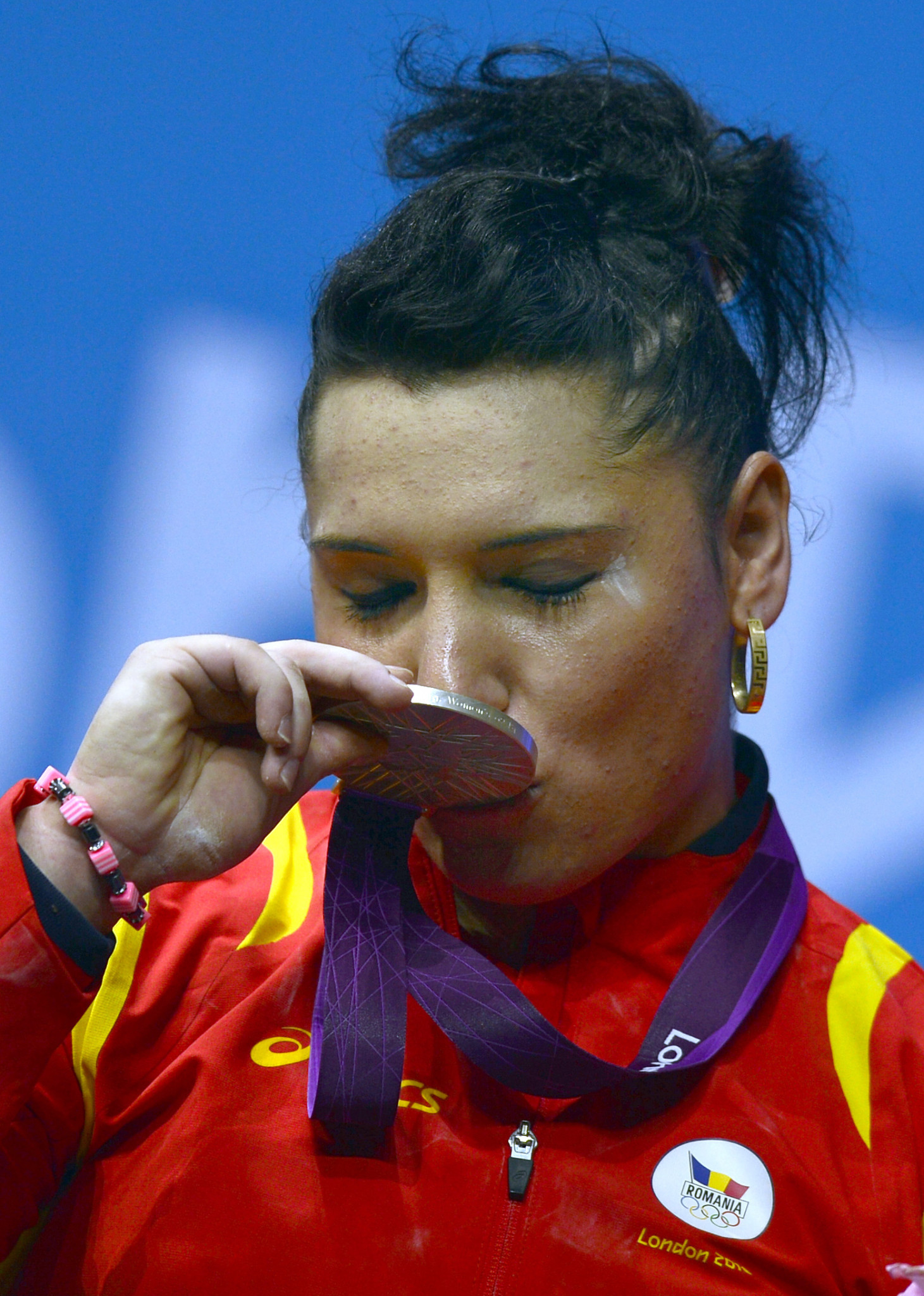 Romania's Roxana Cocos celebrates winning a silver at London 2012 = a medal she is now set to lose after a retest came up positive for anabolic steroids ©Getty Images